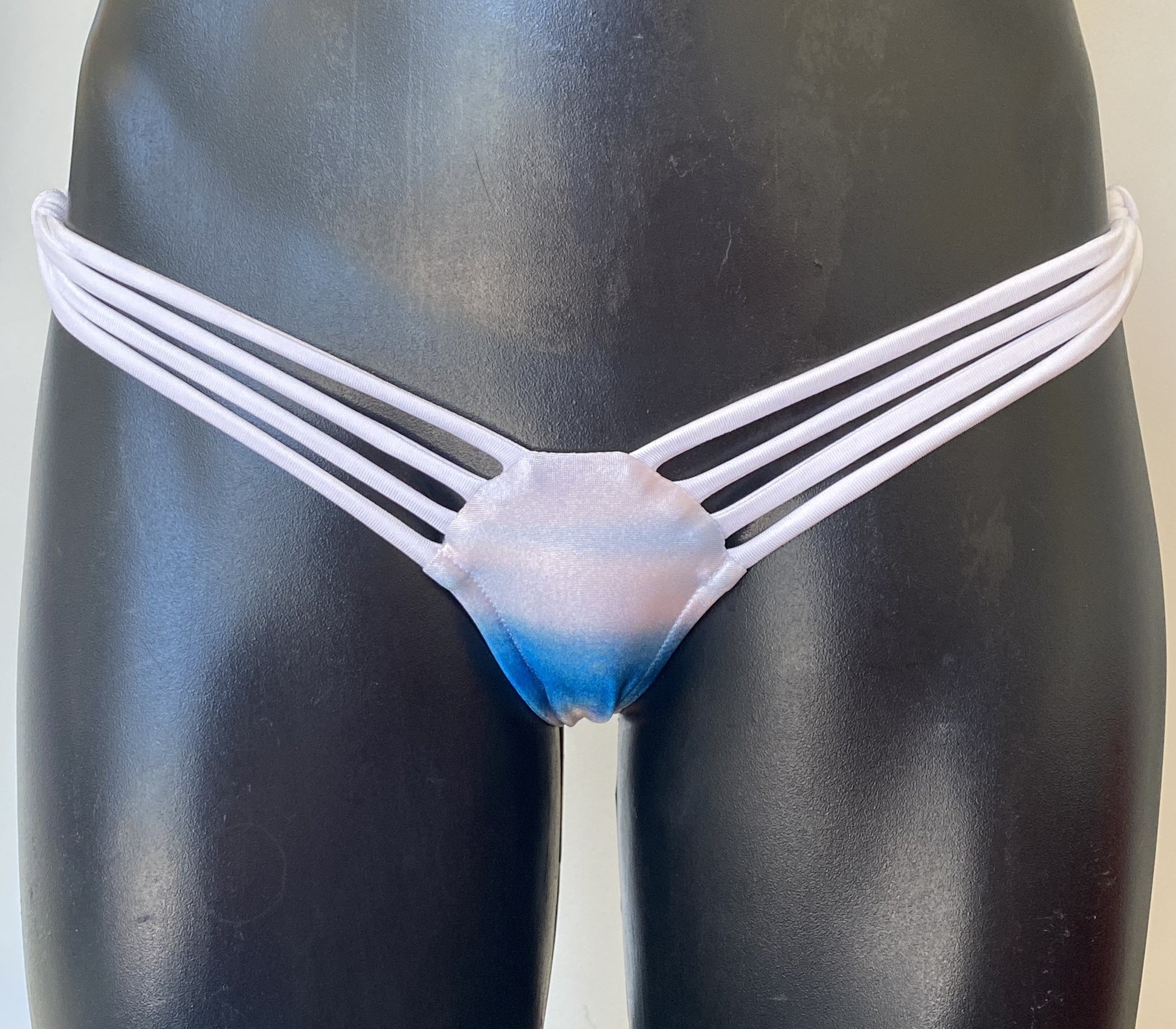 Close up front view of MissManeater SHARKskin strap side bikini pant showing low rise cut and multi strap side detailing Australian made designer swimwear