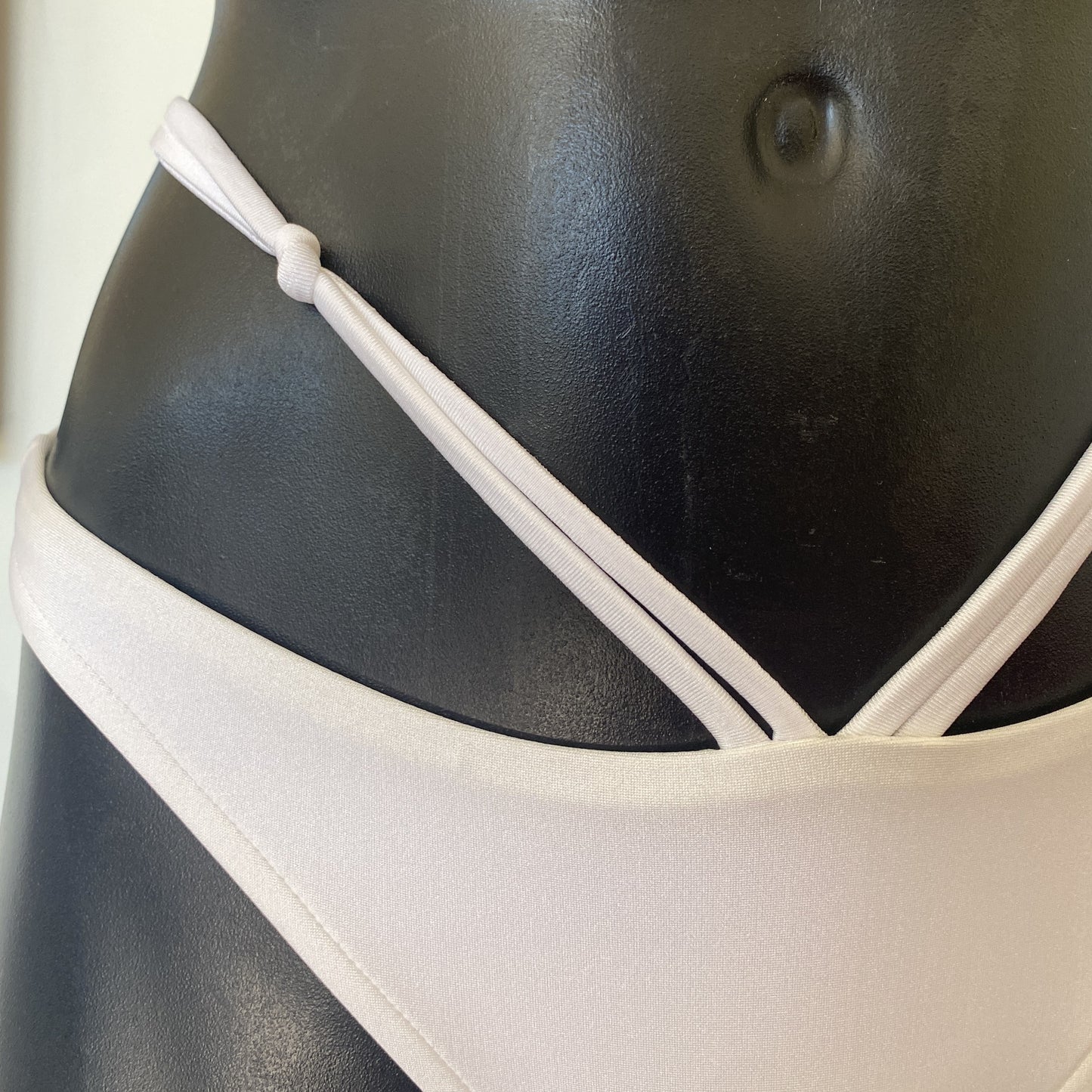 MissManeater white reefknot bikini pant close up showing double strap detail and knot feature Australian made designer swimwear
