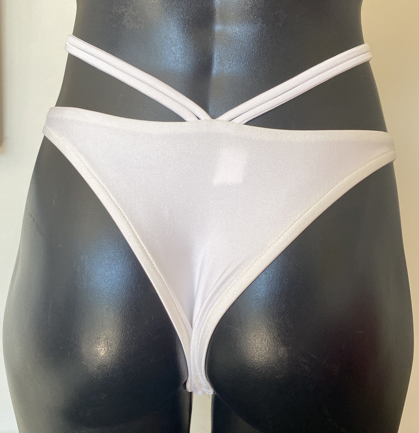 MissManeater white reefknot high cut bikini pant front view showing Brazilian cut and double strap detail on mannequin Australian made designer swimwear
