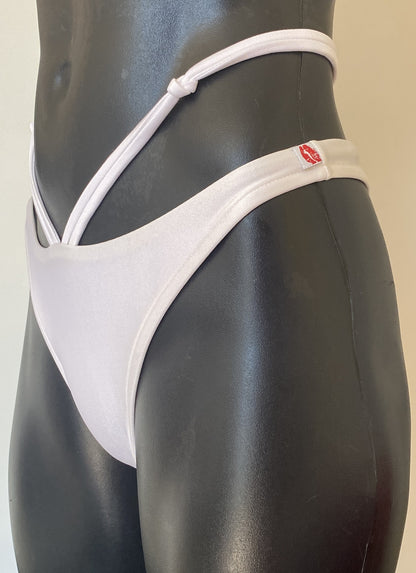 MissManeater white reefknot high cut bikini pant side view showing strap detail and Brazilian cut on mannequin Australian made designer swimwear